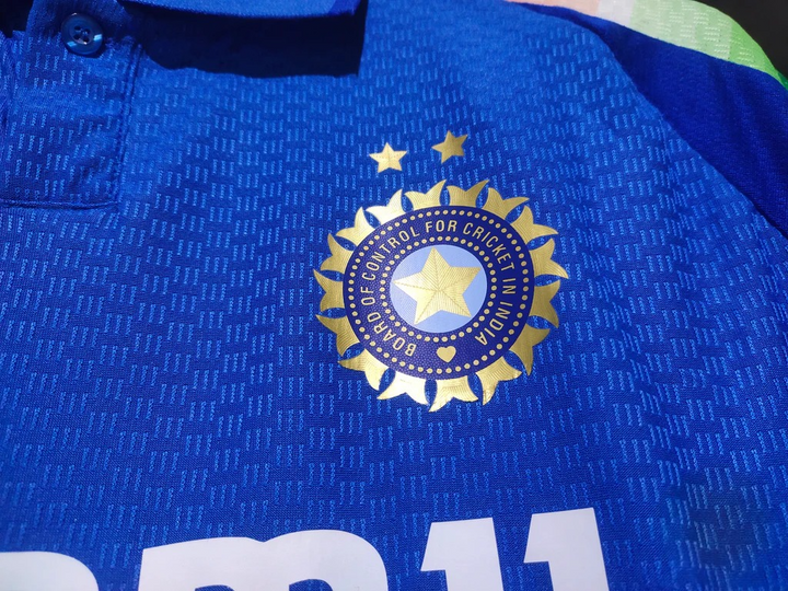 Close-up of 2025 India cricket jersey featuring the BCCI logo in vibrant blue fabric