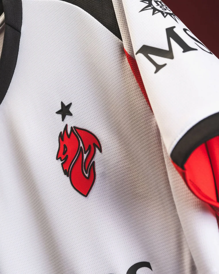 AC Milan away jersey 2025-26 in white with red and black accents featuring team logo and star