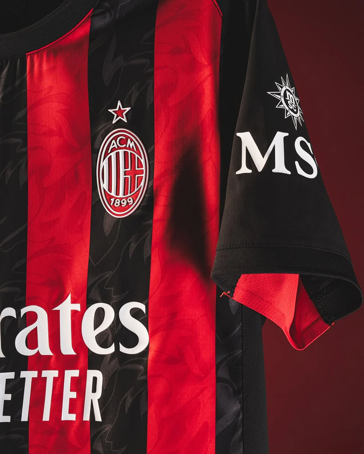 AC Milan home jersey 2025-26 featuring red and black stripes with logo and sponsor details