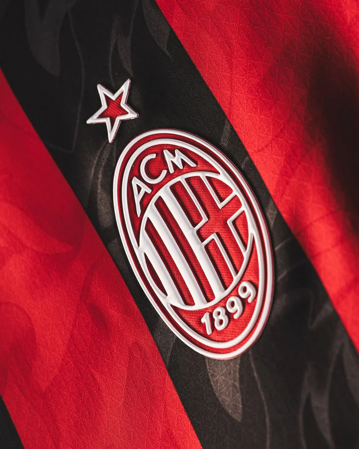 AC Milan home jersey 2025-26 featuring iconic club logo and vibrant red and black stripes