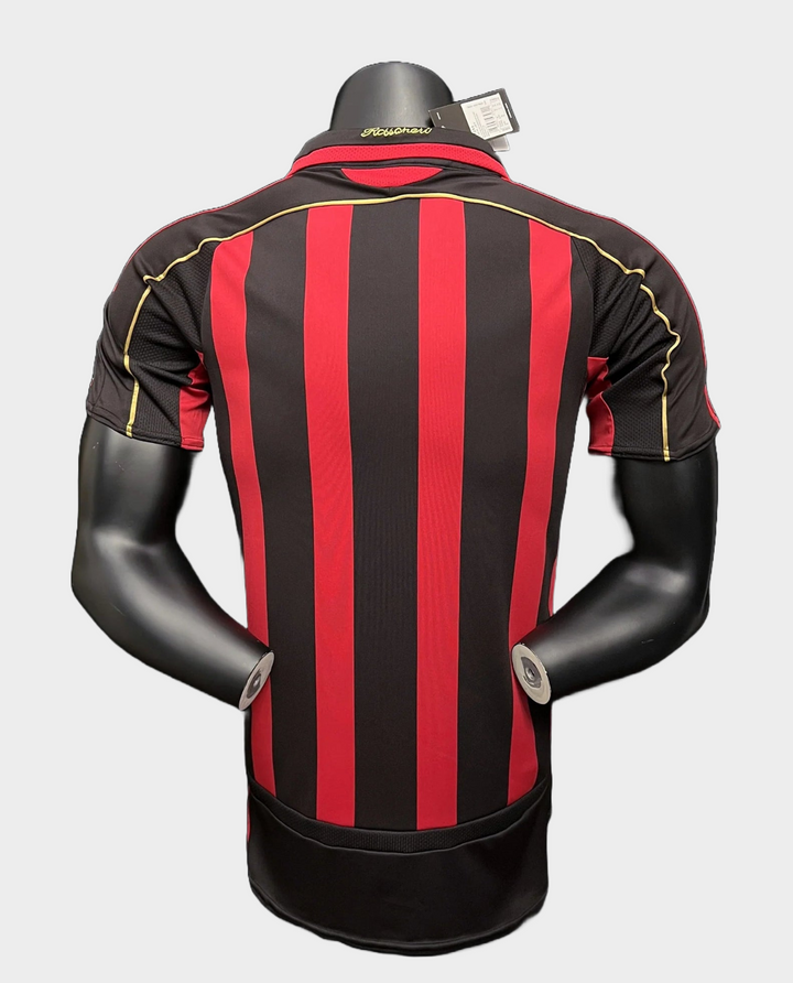 Back view of Retro AC Milan Jersey 2006-07 featuring black and red stripes, designed by Striker Store