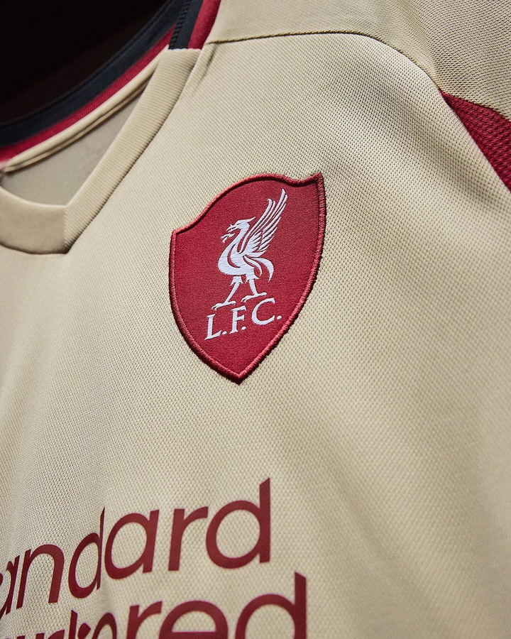 Striker Store Liverpool Away Jersey 2025-26 beige jersey with embroidered LFC crest and sponsor logo