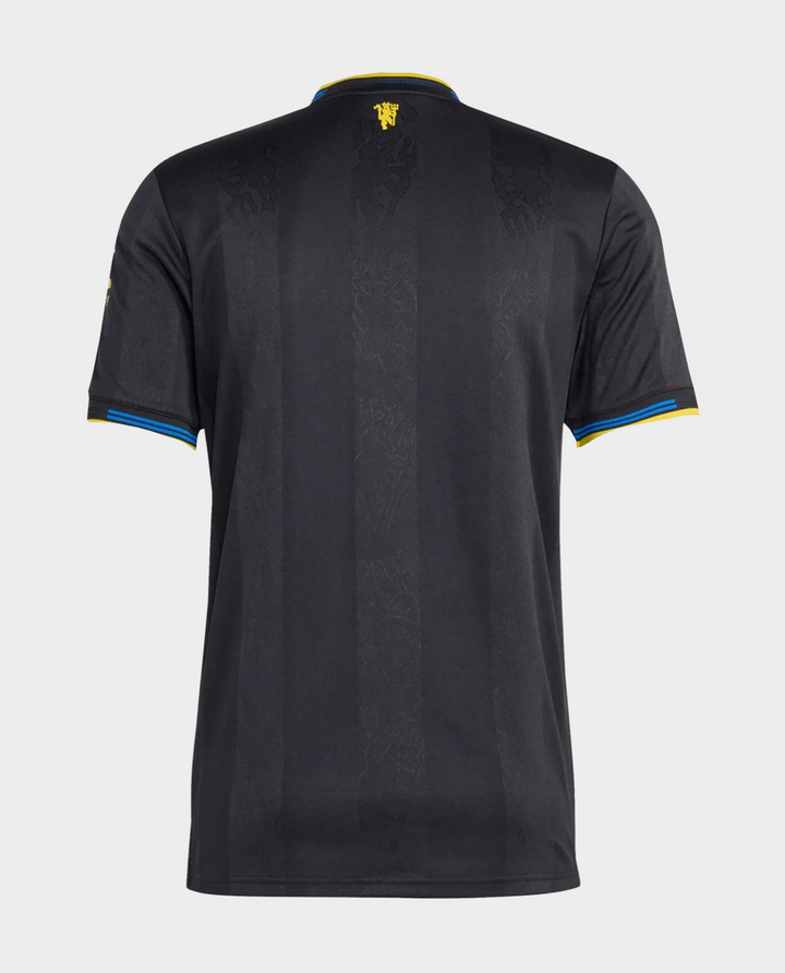 Striker Store black back view Manchester United 2025-26 third jersey with blue and yellow sleeve trim and subtle pattern