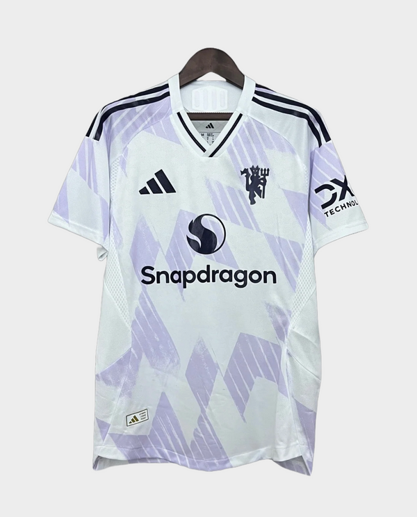 Striker Store Manchester United away jersey 2025-26 in red with black accents and sponsor logos