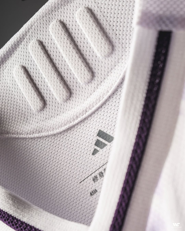 Close-up of collar and fabric detail of Manchester United away jersey 2025-26 from Striker Store