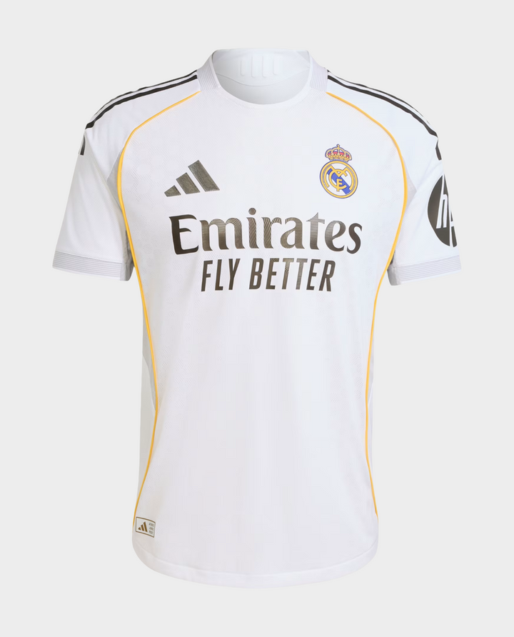 Striker Store Real Madrid 2025 home jersey white with gold piping Adidas logo and Emirates Fly Better sponsor