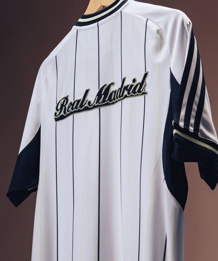 Striker Store Real Madrid special edition jersey 2025-26 white pinstripe back with navy sleeve stripes and script logo
