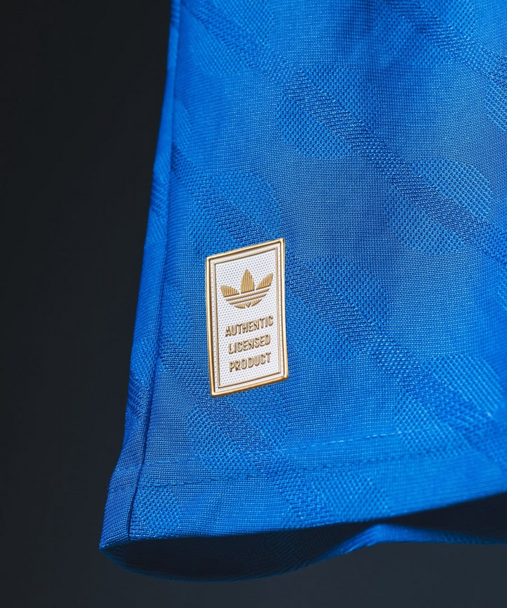 Striker Store close up of blue Real Madrid Third Jersey 2025-26 hem showing Adidas authentic licensed product patch