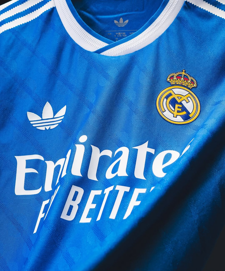 Striker Store Real Madrid Third Jersey 2025-26 blue Adidas trefoil with club crest and Emirates sponsor