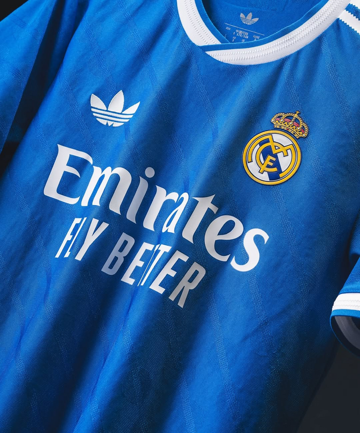 Striker Store Real Madrid Third Jersey 2025-26 blue Adidas trefoil with Emirates Fly Better sponsor and club crest
