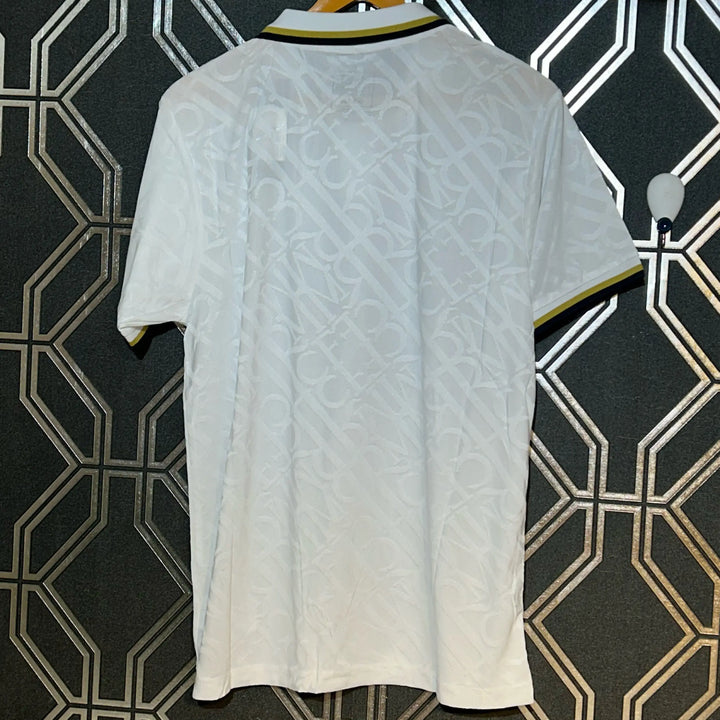 Back view of Real Madrid white gold jersey 2024-25 by Striker Store with subtle pattern and gold trim