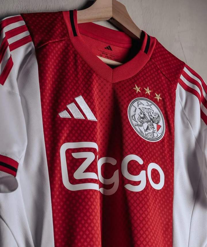 Ajax home jersey 2025-26 player version featuring red and white design with Adidas logo
