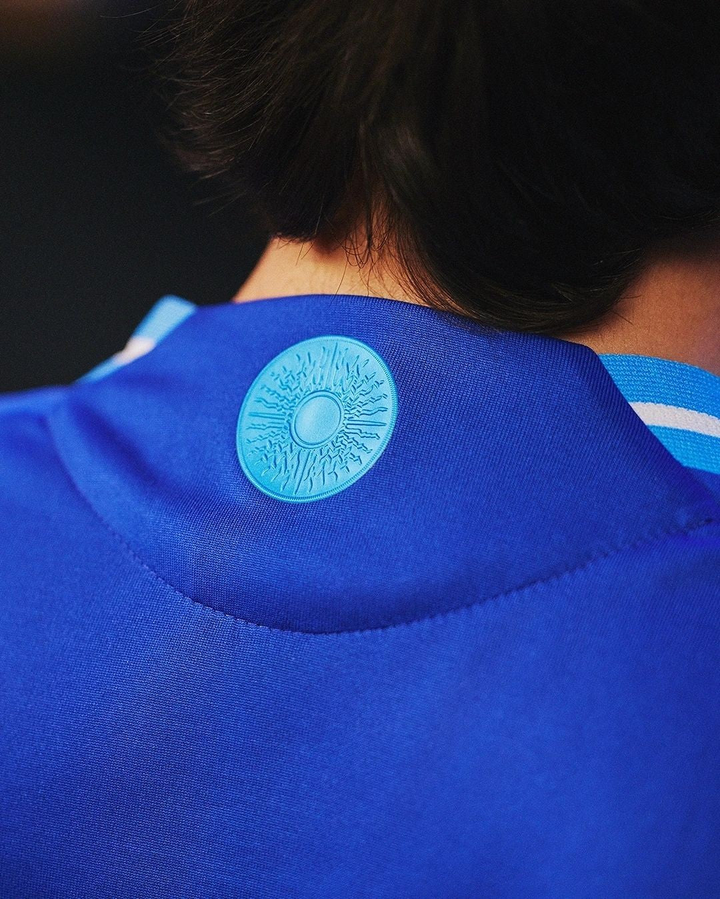Close-up of Argentina away jersey 2024 showing detailed logo and fabric texture in blue