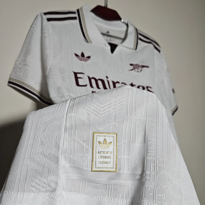 Arsenal 2025 26 third jersey by Striker Store in white with maroon accents and authentic licensed product label