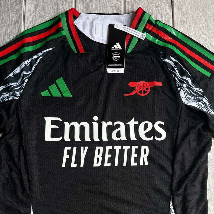 Arsenal away jersey 2024-25 featuring black design with green and red accents and Emirates logo