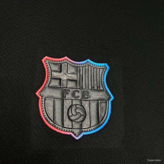 Barcelona Away Jersey 2024-25 featuring the iconic FCB crest in vibrant colors