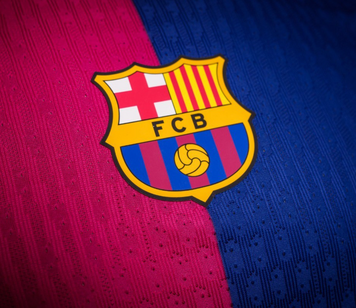 Close-up of Barcelona Home Jersey 2024 featuring the iconic club crest and vibrant colors