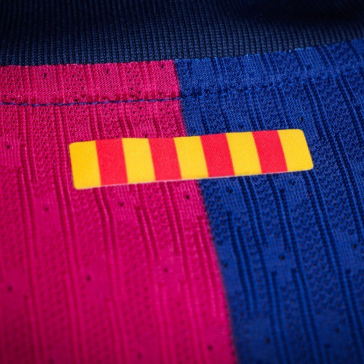 Close-up of Barcelona Home Jersey 2024 featuring vibrant team colors and detailed fabric texture