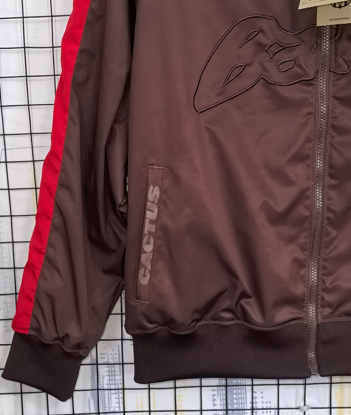 Barcelona Travis Scott windbreaker in brown with red accents and iconic cactus logo detailing