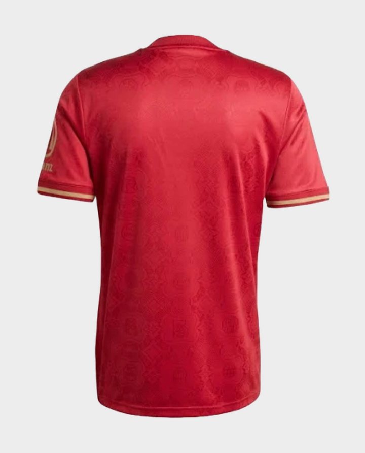 Back view of Bayern Munich 125th Anniversary Jersey in red with decorative pattern and gold trim