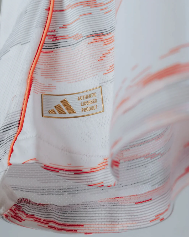 Bayern Munich 2025-26 away jersey player with adidas logo and licensed product tag