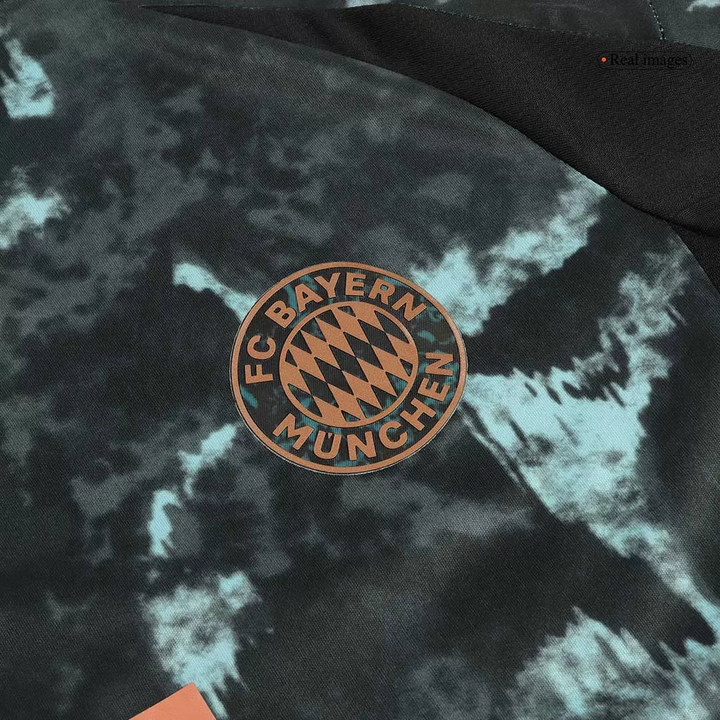 Close-up of Bayern Munich away jersey 2024 featuring club logo in a stylish design