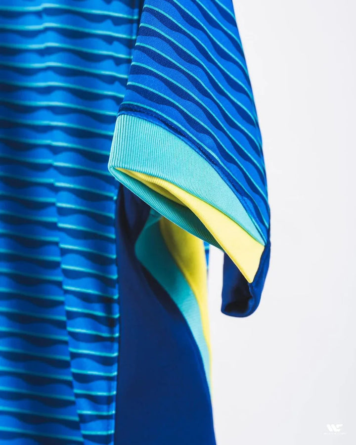 Brazil away jersey 2024-25 featuring a blue and green striped design with vibrant colors