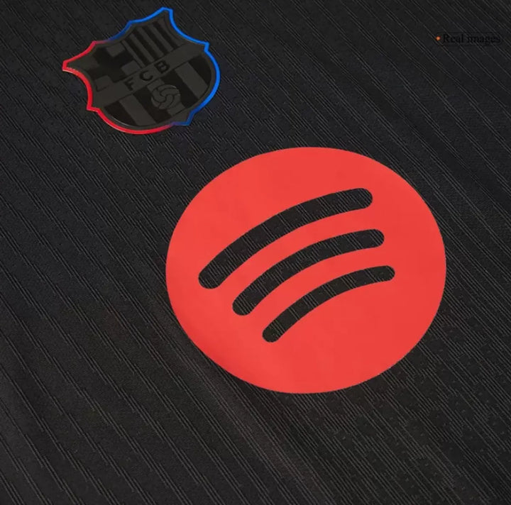 Close-up of the Barcelona Away Jersey 2024-25 logo and Spotify patch for fans of FC Barcelona
