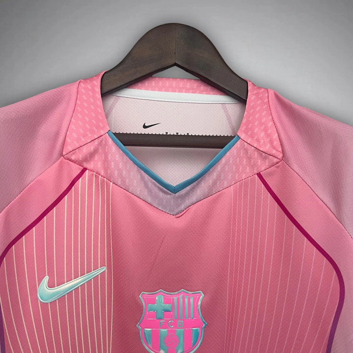 FC Barcelona Pink Jersey 2025 with Nike logo and club crest on a hanger by Striker Store