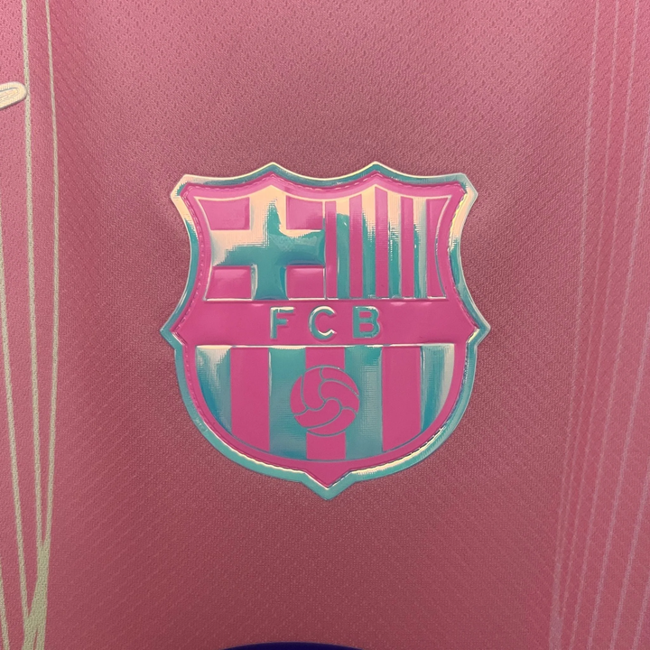 Close-up of FC Barcelona Pink Jersey 2025 with detailed club crest on pink fabric