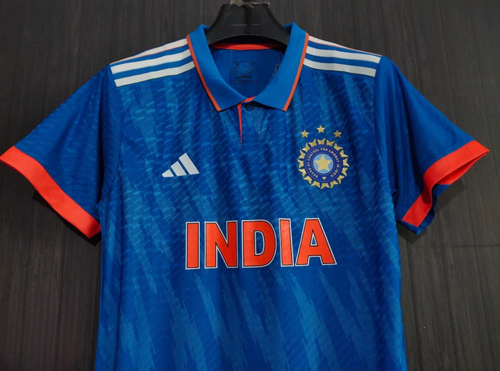 Striker Store India ODI cricket jersey 2024 in blue with vibrant orange detailing and team logo