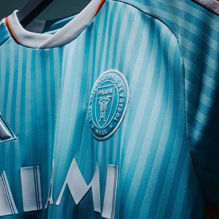 Striker Store Inter Miami 2024 jersey in teal color with striped design and team logo