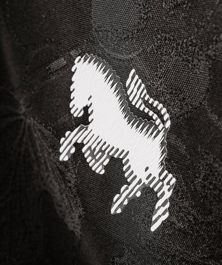 Close-up of the Juventus 25-26 third jersey featuring a distinctive horse logo in white