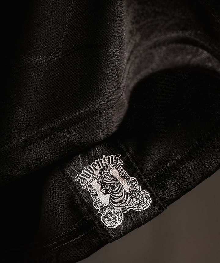 Close-up of the Juventus 25-26 third jersey tag showcasing the iconic zebra logo