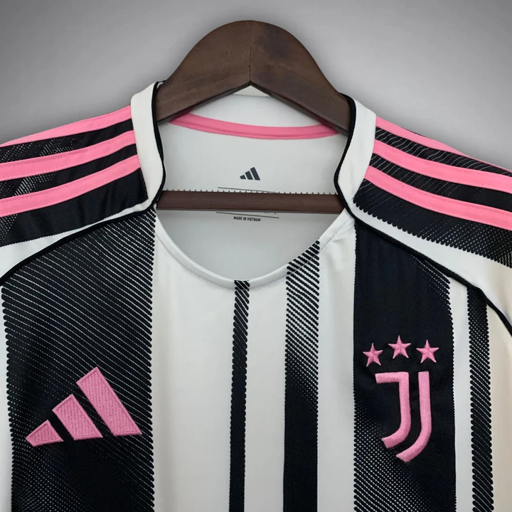 Juventus Home Jersey 25-26 player featuring black and white stripes with pink accents and Adidas branding