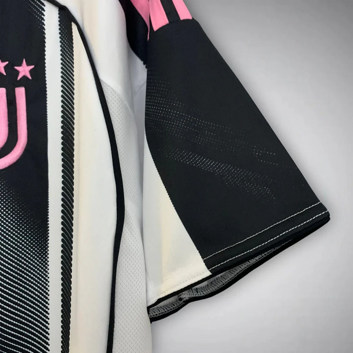 Juventus Home Jersey 25-26 player with striking black and white design and pink accents