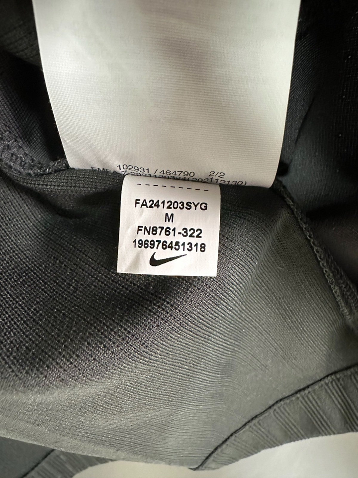 Liverpool away jersey 2024-25 fan version tag showing size and care instructions