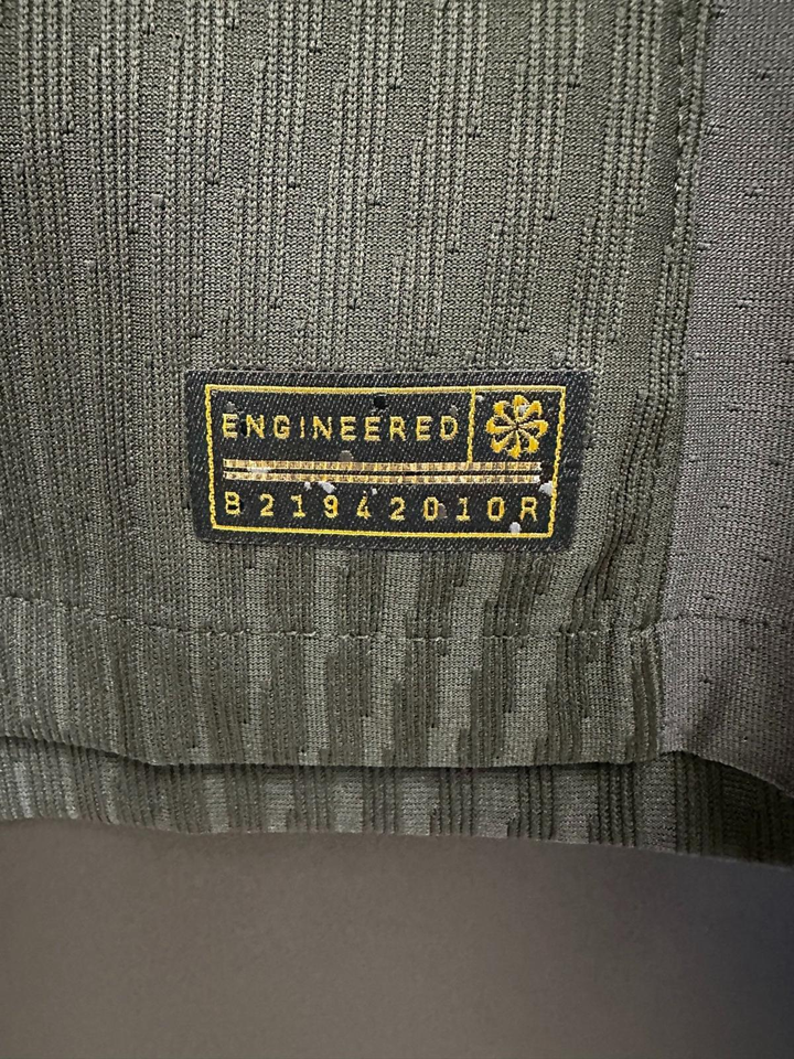 Detail of the Liverpool away jersey 2024-25 fan version label showcasing engineered craftsmanship
