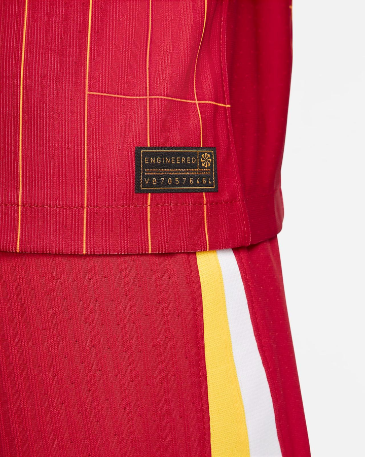 Close-up of Liverpool home jersey 2024-25 featuring the engineered tag and vibrant red design