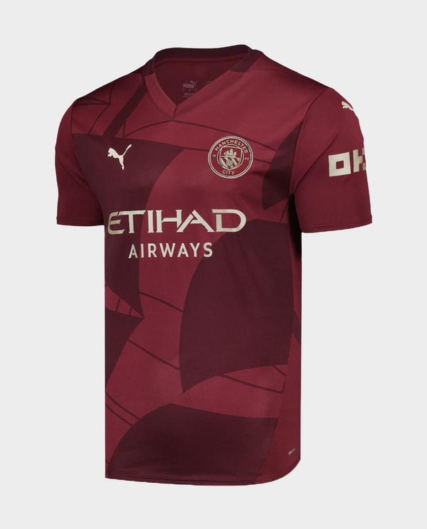 Manchester City 2024 third jersey in maroon with logo and Etihad Airways branding