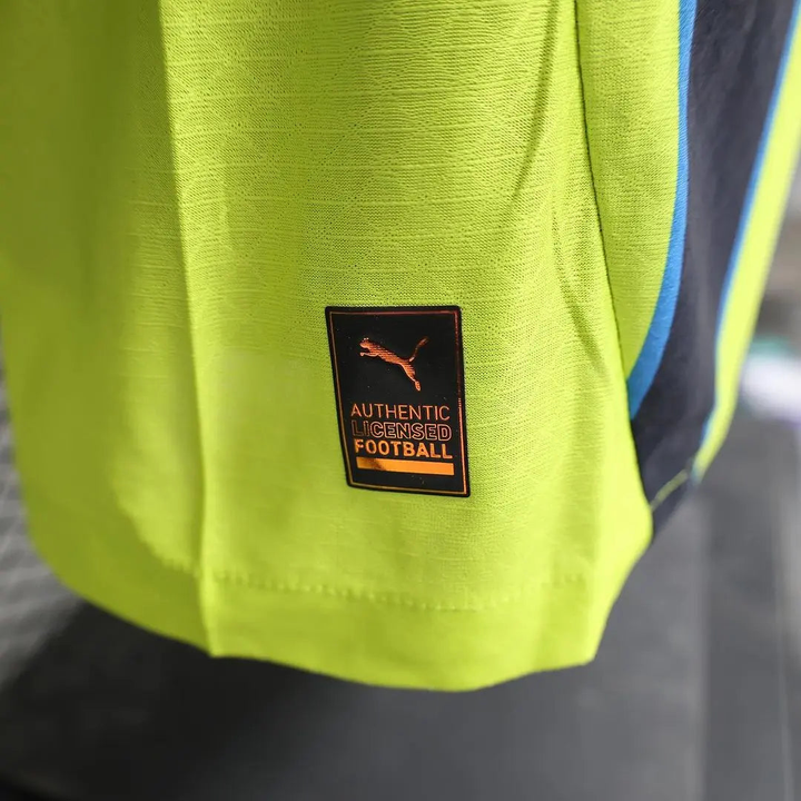 Close-up of the Authentic tag on Manchester City away jersey player version from Striker Store