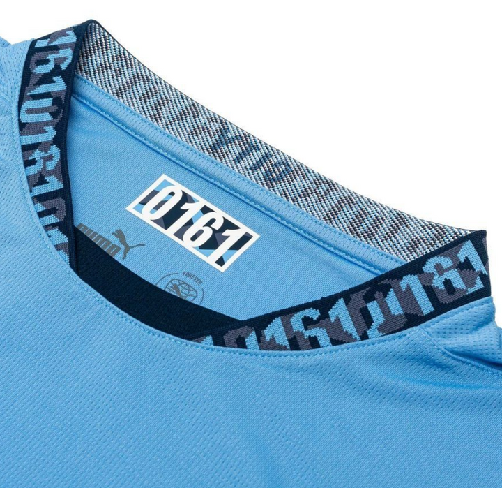 Close-up of the collar on the Manchester City home jersey 2024 showcasing the stylish design and fabric detail