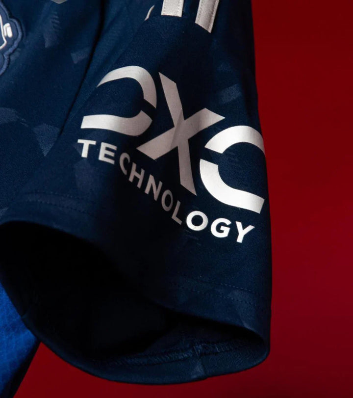 Close-up of Manchester United 2024-25 away jersey showing sleeve detail with EXO Technology branding