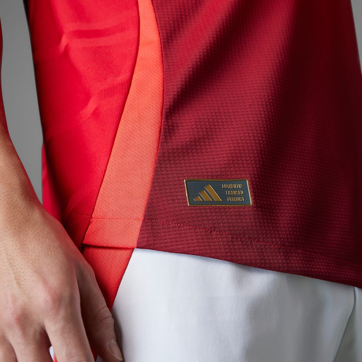 Close-up of Manchester United jersey 2024-25 showcasing fabric details and logo tag