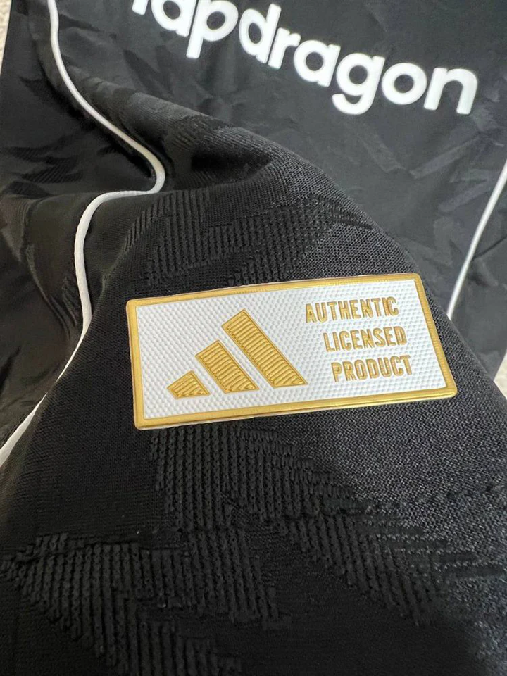 Close-up of black Manchester United Third Jersey 2025-26 player version showing authentic licensed product patch