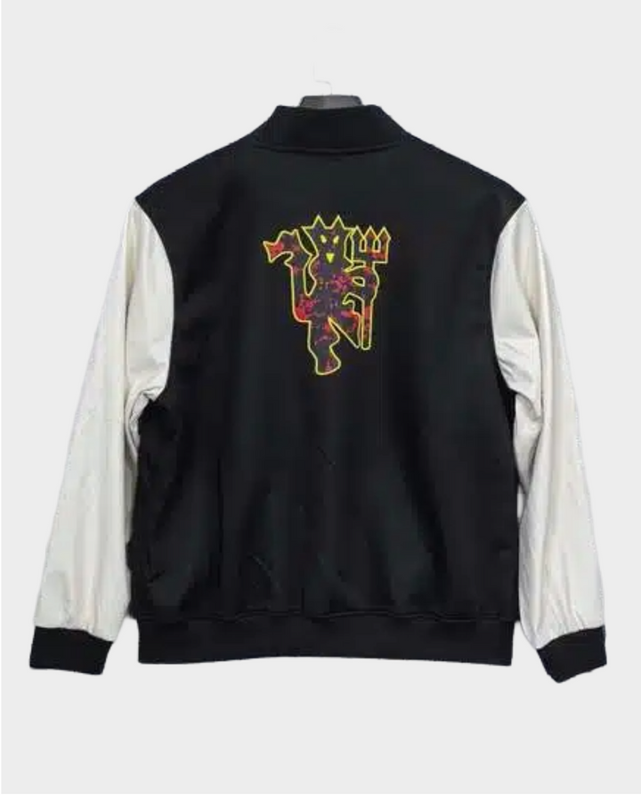 Back view of Manchester United varsity jacket 2025-26 with iconic crest design and lightweight windbreaker style