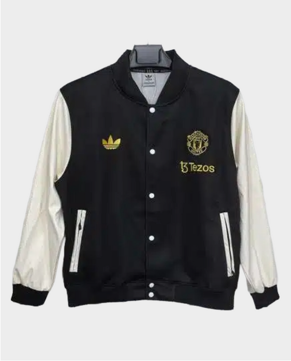 Stylish black Manchester United varsity jacket 2025-26 with gold accents and white sleeves