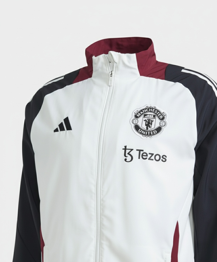 Manchester United white windbreaker 2025 with team logo and contrasting colors on the sleeves