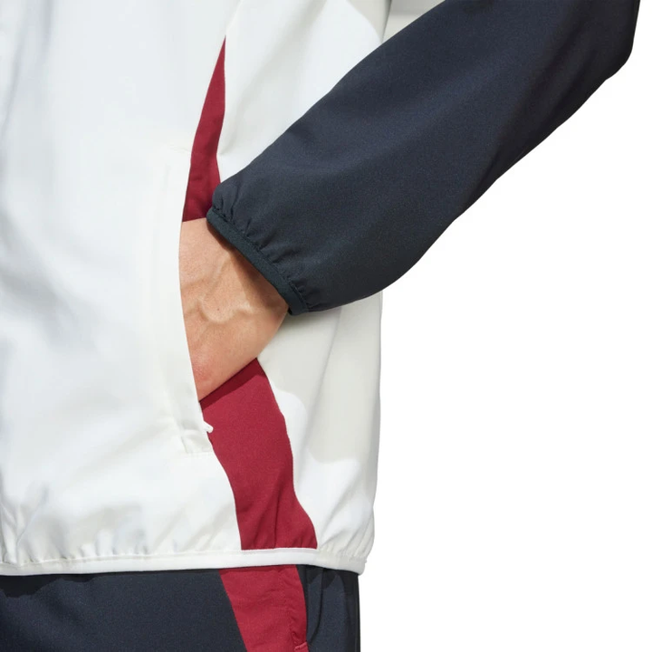 Manchester United white windbreaker 2025 with contrasting color design and zippered pockets