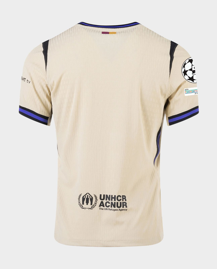 Striker Store Barcelona away jersey 2025-26 beige back view with UNHCR logo and Champions League sleeve patch